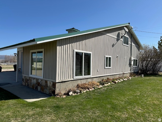 1454 East Little Sweden Road Heber City, UT 84032 - Photo 18 of 35 View of property exterior featuring a lawn, a chimney, and stone siding