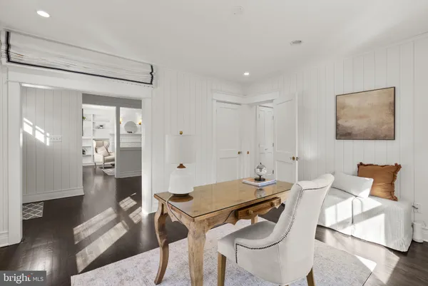 a bedroom with a bed and a night stand