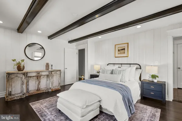 a bathroom with double sink and two mirror