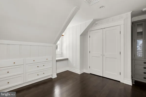 a kitchen with a refrigerator and cabinets