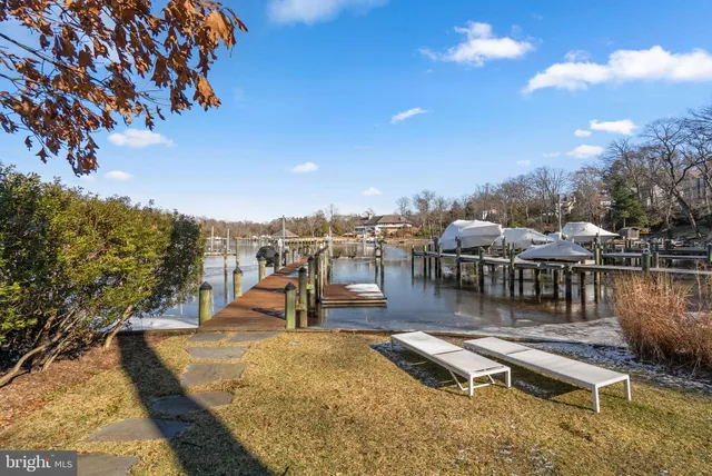 an aerial view of a house with a lake view