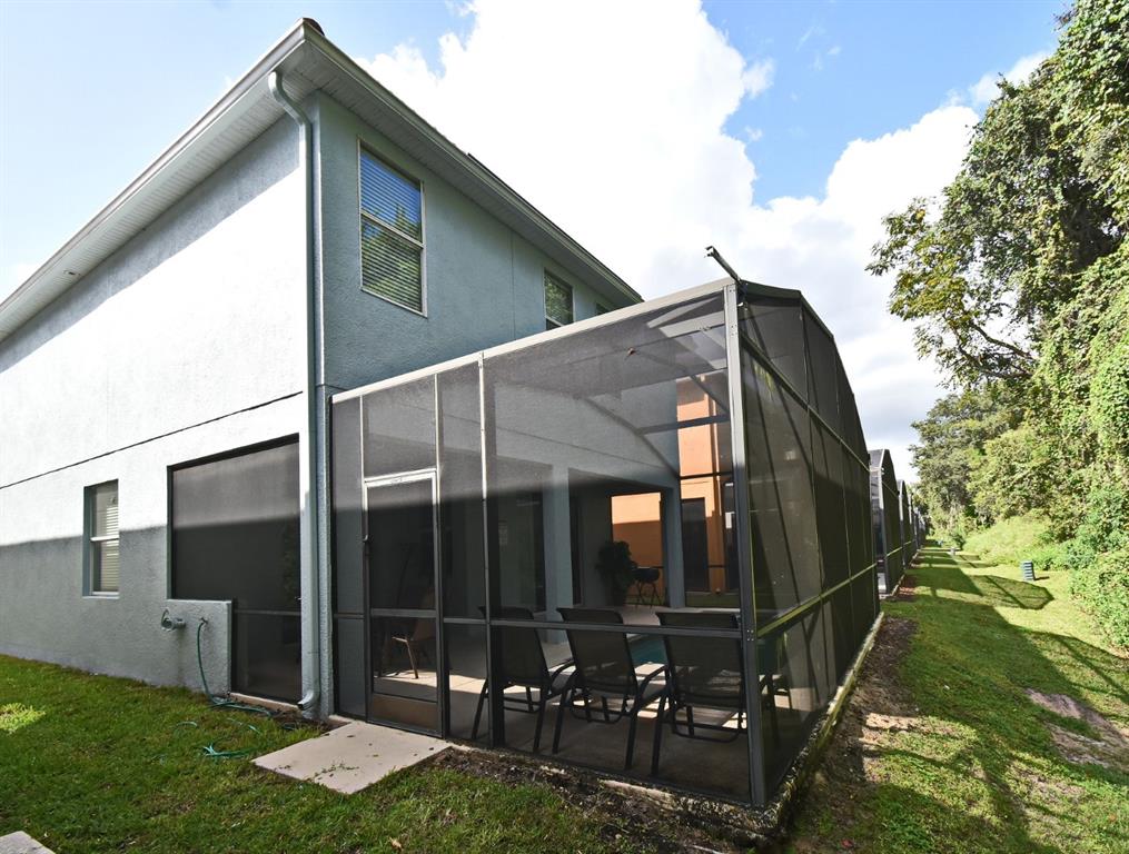 8878 Candy Palm Road Kissimmee, FL 34747 - Photo 21 of 70 a backyard of a house with lots of green space