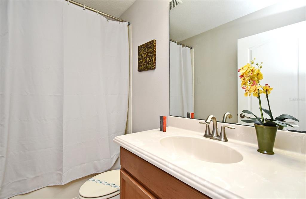 8878 Candy Palm Road Kissimmee, FL 34747 - Photo 39 of 70 a bathroom with a sink and a toilet