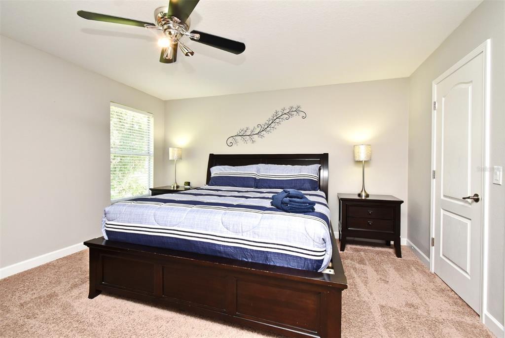 8878 Candy Palm Road Kissimmee, FL 34747 - Photo 53 of 70 a bedroom with bed and window