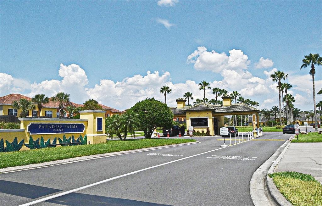 8878 Candy Palm Road Kissimmee, FL 34747 - Photo 59 of 70 a front view of multi story residential apartment building with a yard