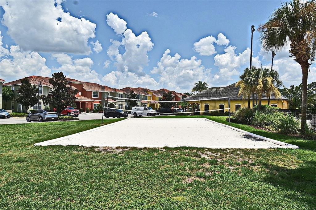 8878 Candy Palm Road Kissimmee, FL 34747 - Photo 60 of 70 a aerial view of a house with a yard and a large tree