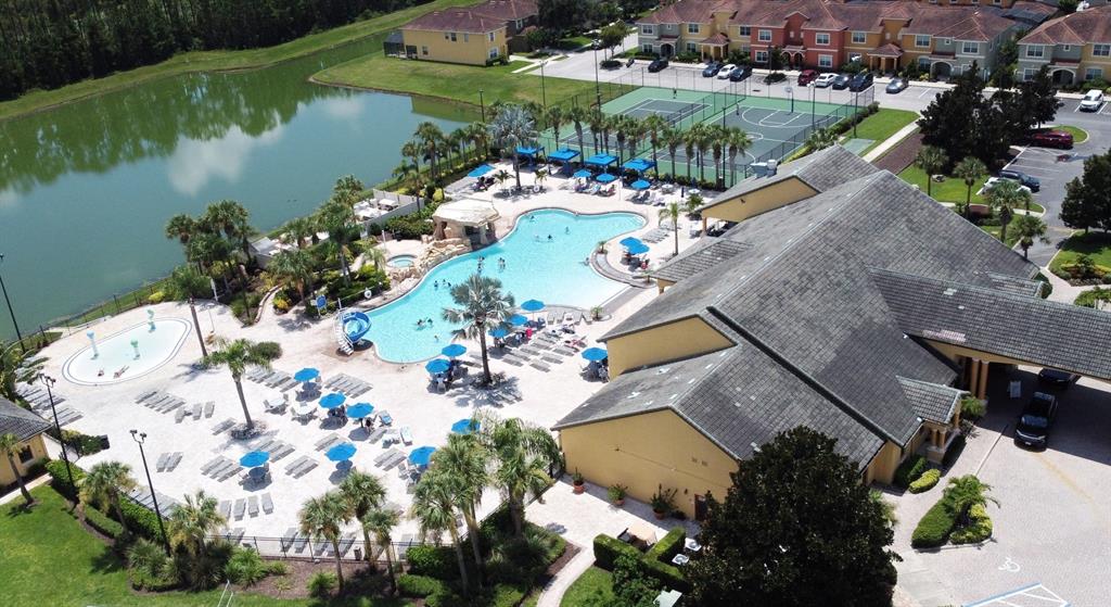8878 Candy Palm Road Kissimmee, FL 34747 - Photo 64 of 70 an aerial view of a house a garden and lake view