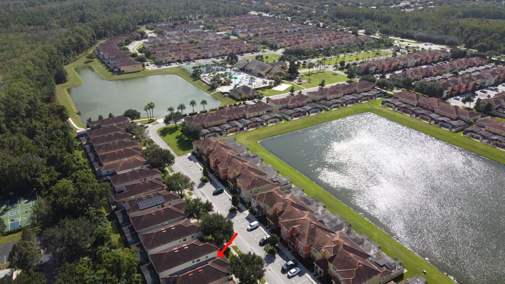 8878 Candy Palm Road Kissimmee, FL 34747 - Photo 66 of 70 an aerial view of a house with a lake view