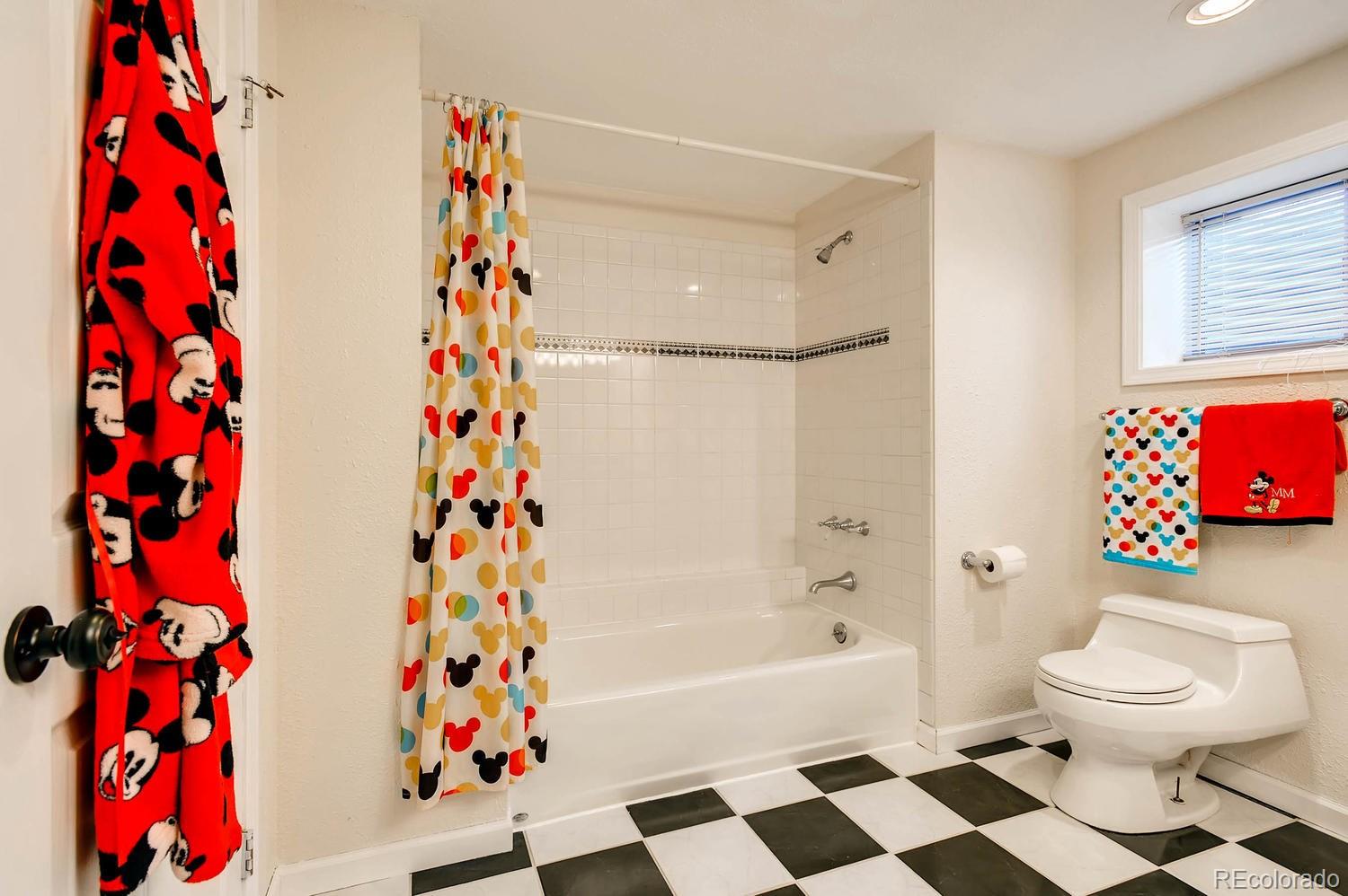 303 West Baseline Road Lafayette, CO 80026 - Photo 24 of 28 a white bath tub sitting next to a white sink and a toilet