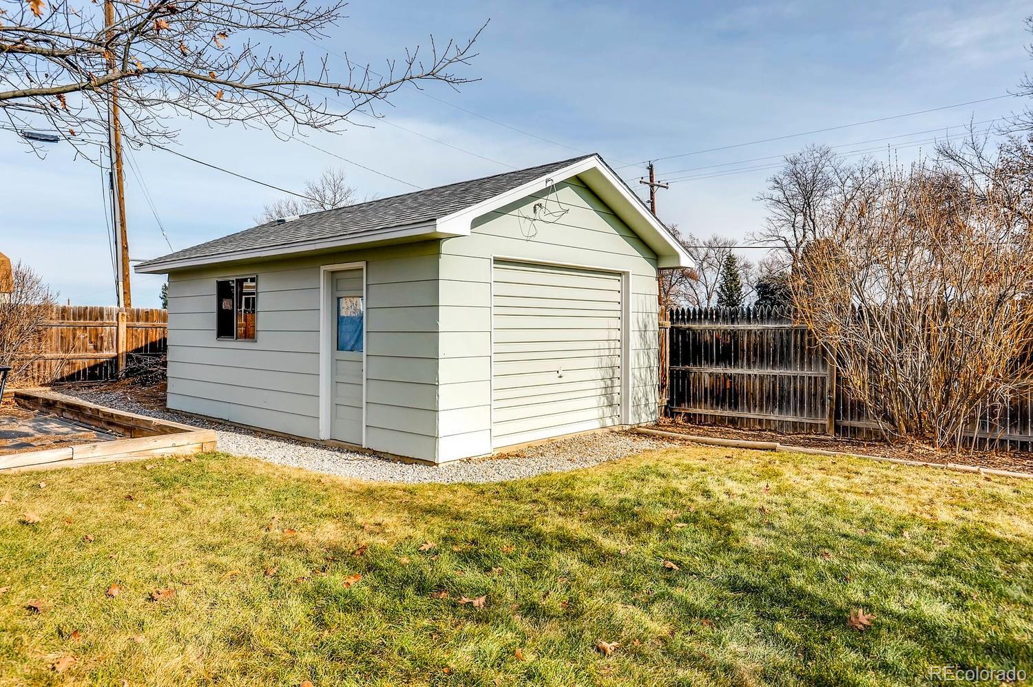 303 West Baseline Road Lafayette, CO 80026 - Photo 27 of 28 a view of a house with a yard
