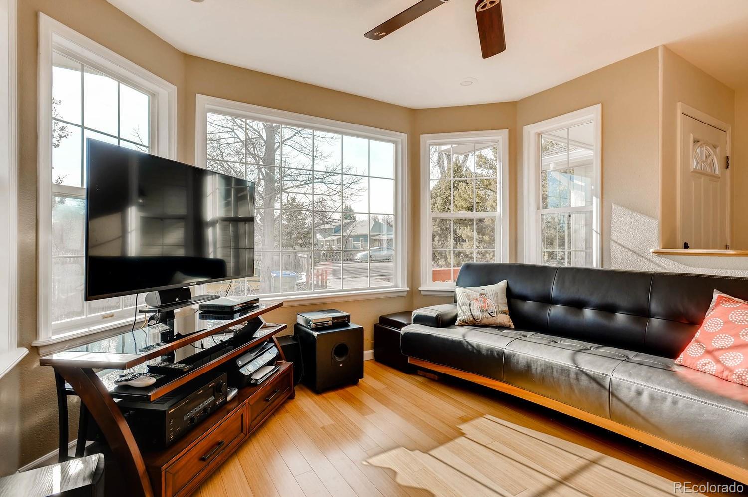 303 West Baseline Road Lafayette, CO 80026 - Photo 4 of 28 a living room with furniture and a flat screen tv
