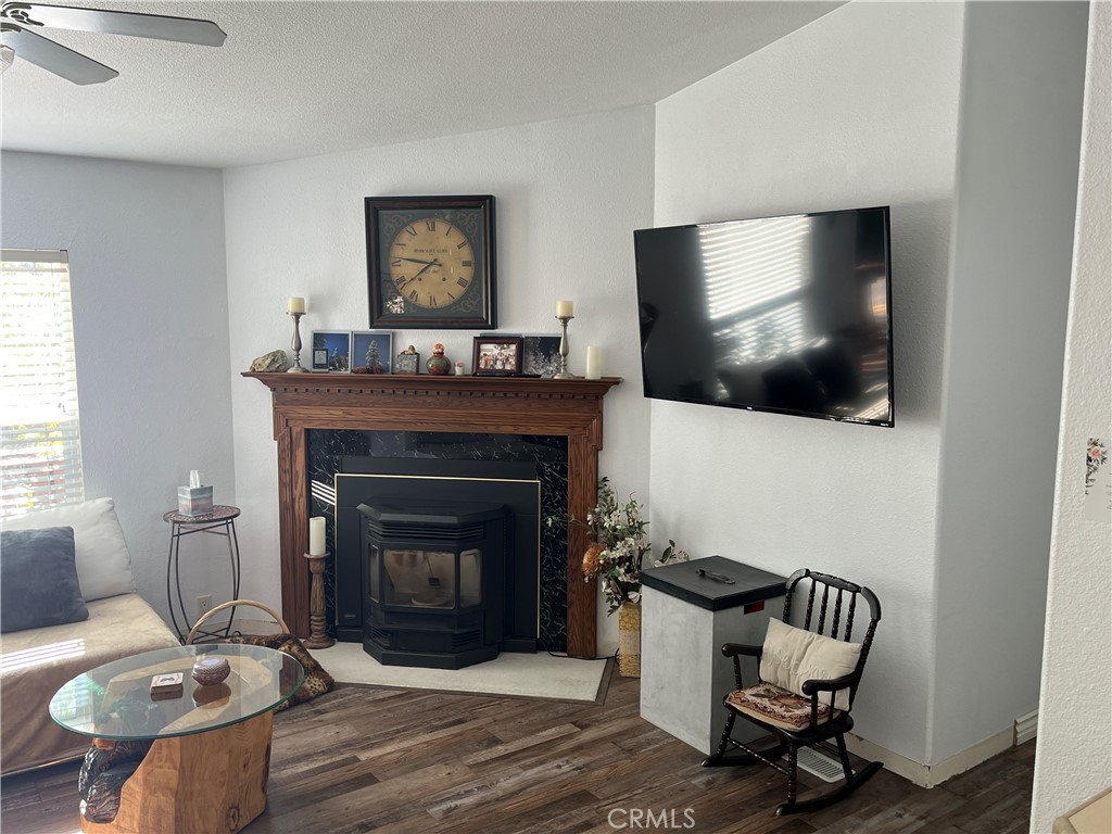 39950 7 Oaks Road, Unit 41 Angelus Oaks, CA 92305 - Photo 8 of 27 a living room with furniture and a fireplace