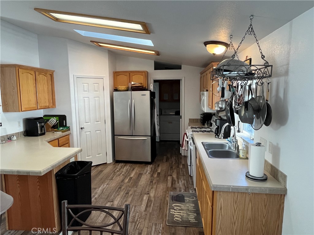 39950 7 Oaks Road, Unit 41 Angelus Oaks, CA 92305 - Photo 10 of 27 a kitchen with refrigerator and sink