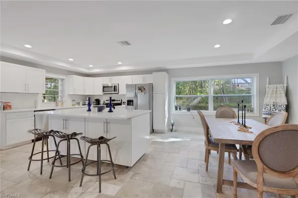 a dining room with furniture and window