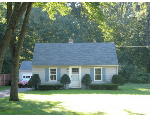 76 Senator Street Springfield, MA 01129 - Photo 1 of 1 a front view of a house with a yard and trees