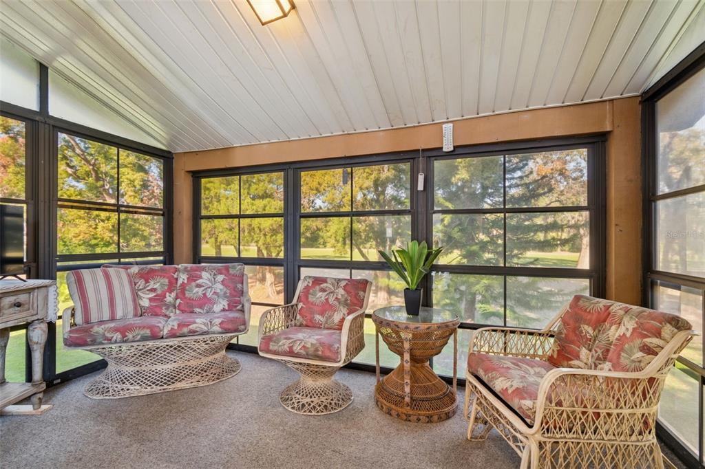 12906 Wedgewood Way, Unit D Hudson, FL 34667 - Photo 18 of 54 a living room with furniture and a large window