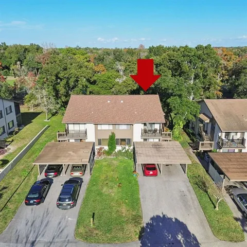 an aerial view of a house with a swimming pool