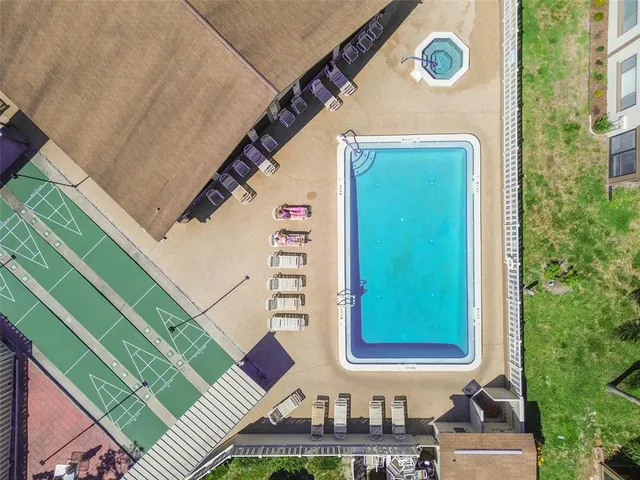 an aerial view of a house with big yard