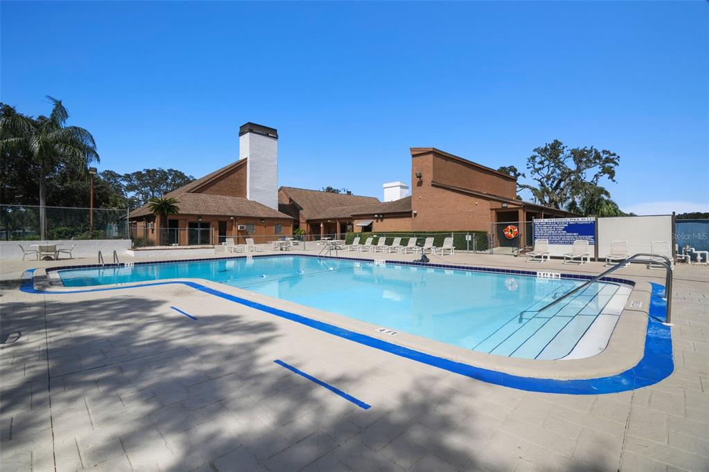 12906 Wedgewood Way, Unit D Hudson, FL 34667 - Photo 53 of 54 a view of a house with a swimming pool