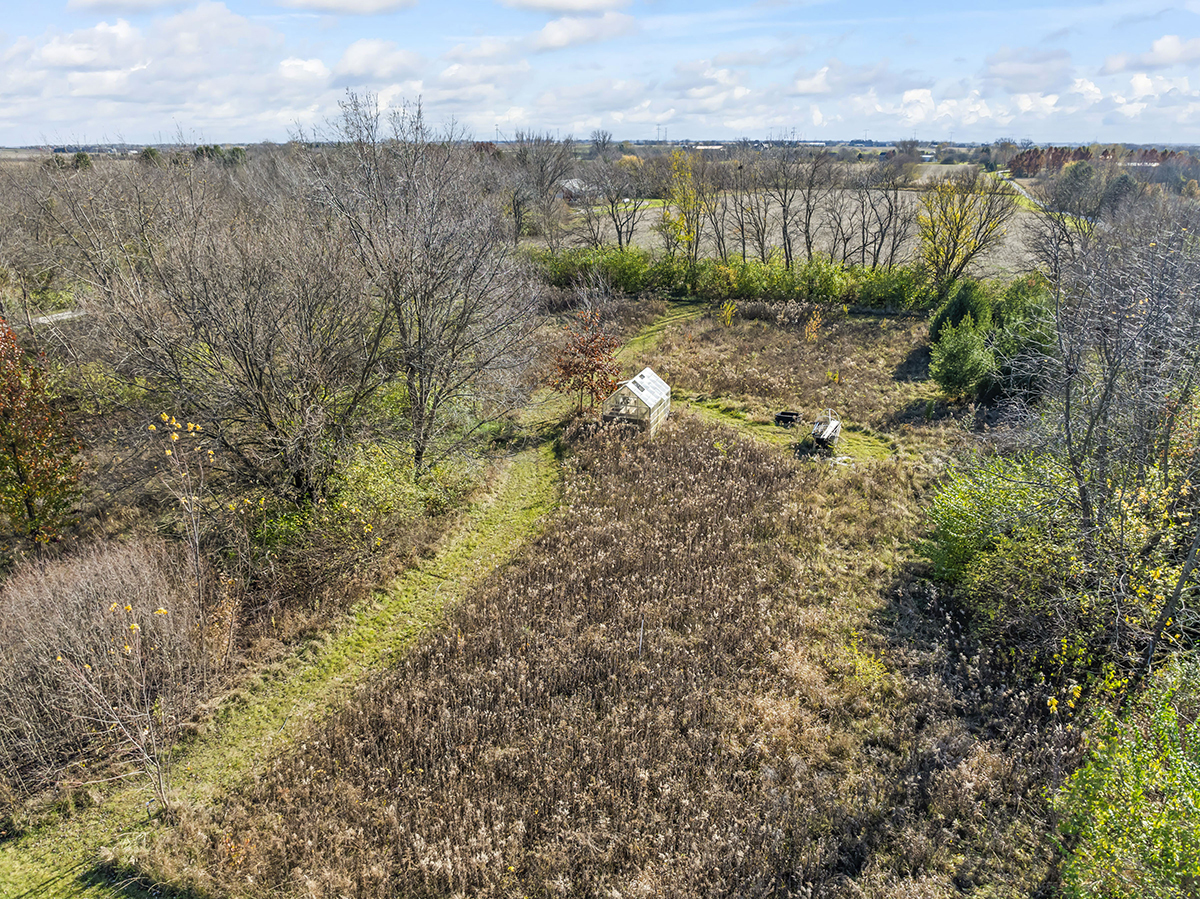 12945 Smith Road Manhattan, IL 60442 - Photo 33 of 43 a view of a lake with a city