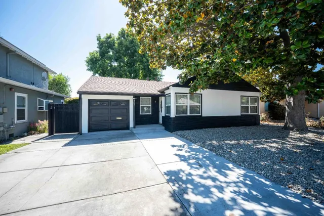 a front view of a house with yard