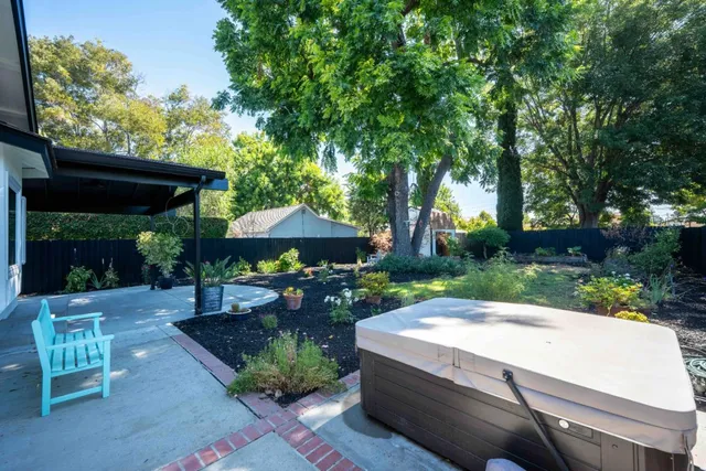 a view of a table and chairs under an umbrella
