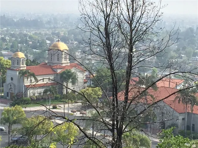 a view of a city with mountains in the background