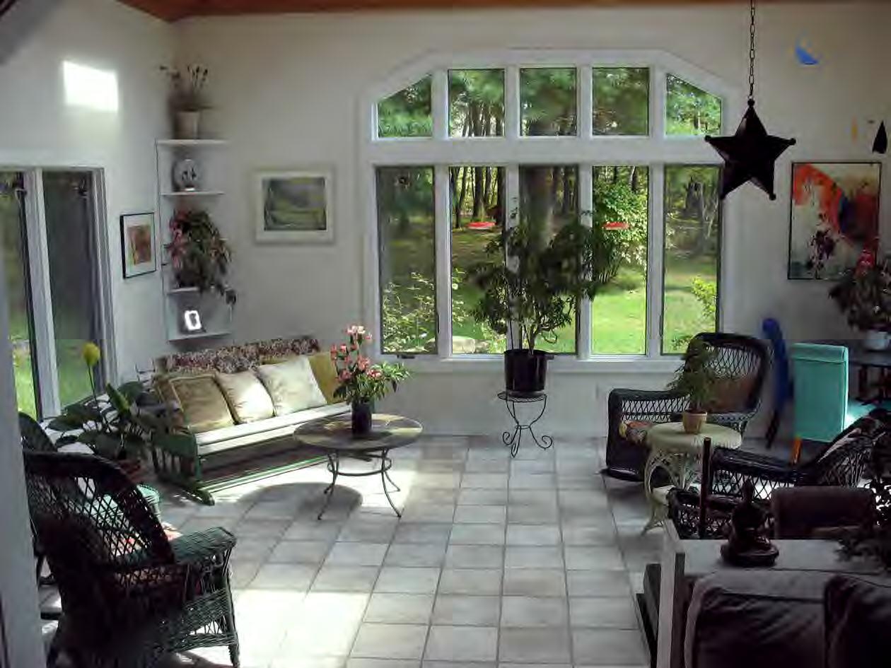 33 West Hubbard Road Sandisfield, MA 01255 - Photo 3 of 6 a living room with furniture a fireplace and a floor to ceiling window