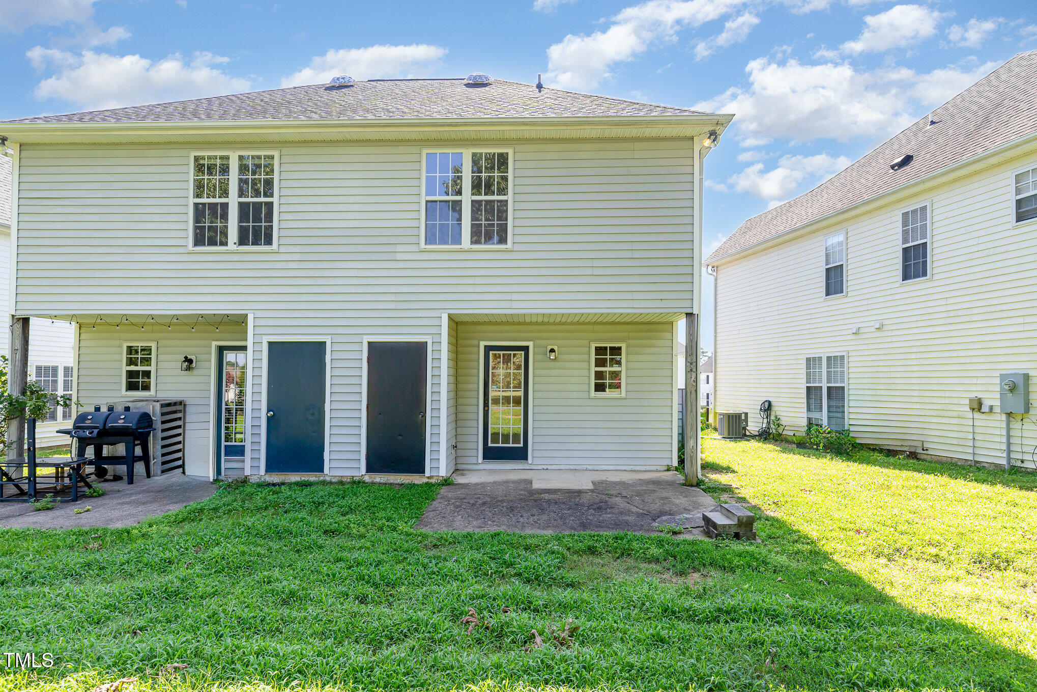 2125 Ventana Lane Raleigh, NC 27604 - Photo 18 of 19 a view of a house with a yard and lawn chairs