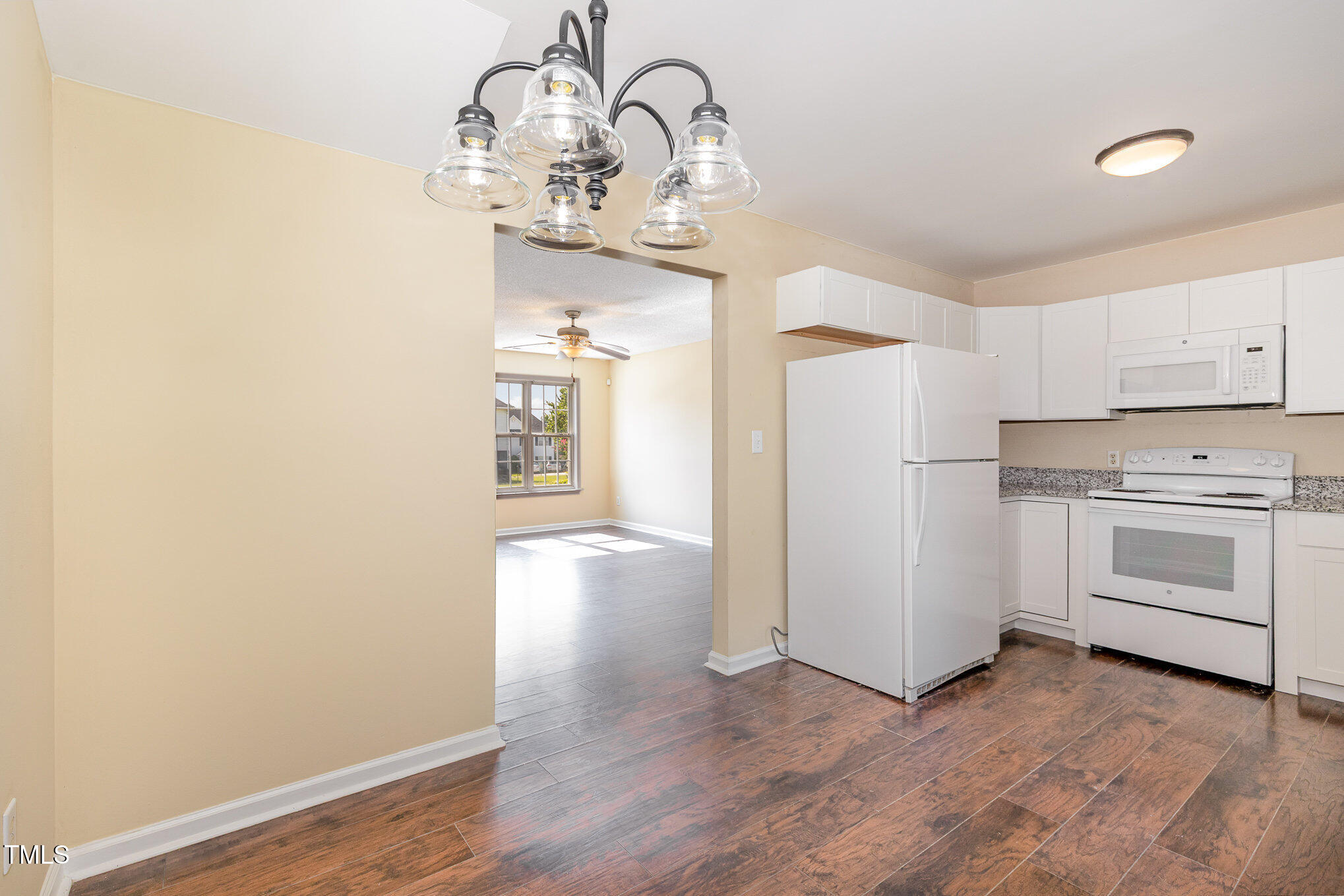 2125 Ventana Lane Raleigh, NC 27604 - Photo 4 of 19 a view of an empty room with a kitchen
