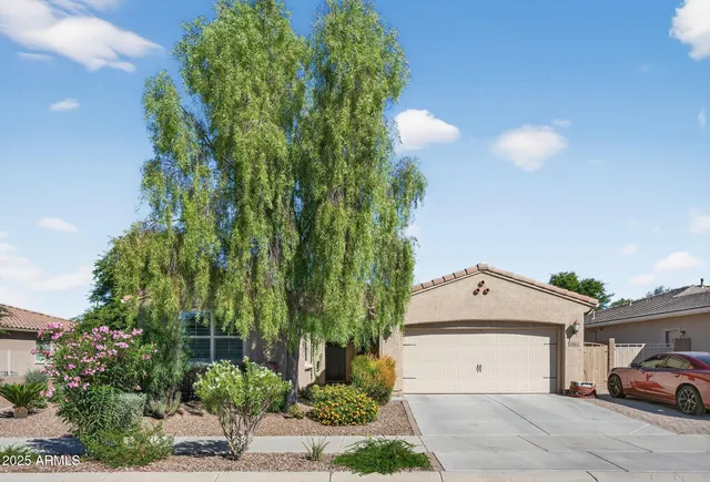 a front view of a house with garden