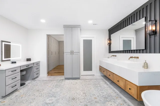 a bathroom with a bathtub and a shower