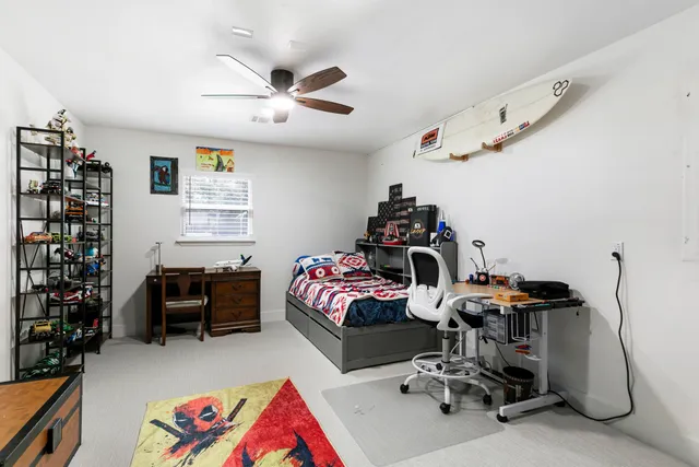 a bedroom with bed and a window