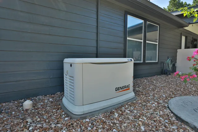 a view of a chair and tables in the patio