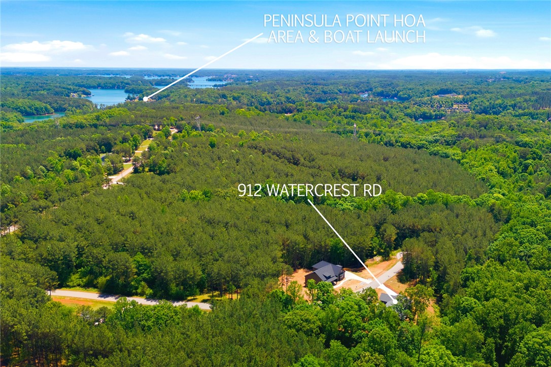 912 Watercrest Road West Union, SC 29696 - Photo 44 of 49 This aerial view showcases a private residence nestled amidst lush greenery and serene waterfront views.