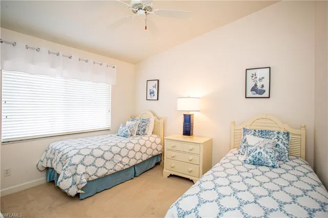 a bedroom with a bed and a lamp