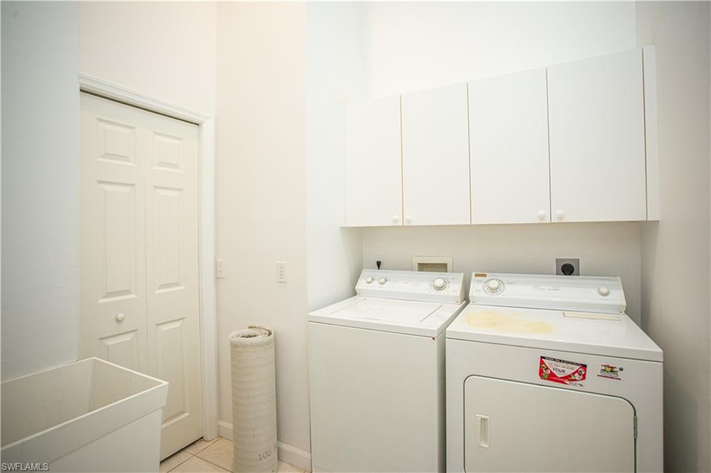 6760 Beach Resort Drive, Unit 2 Naples, FL 34114 - Photo 15 of 24 a utility room with dryer and washer
