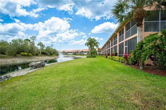 a view of a garden with a house