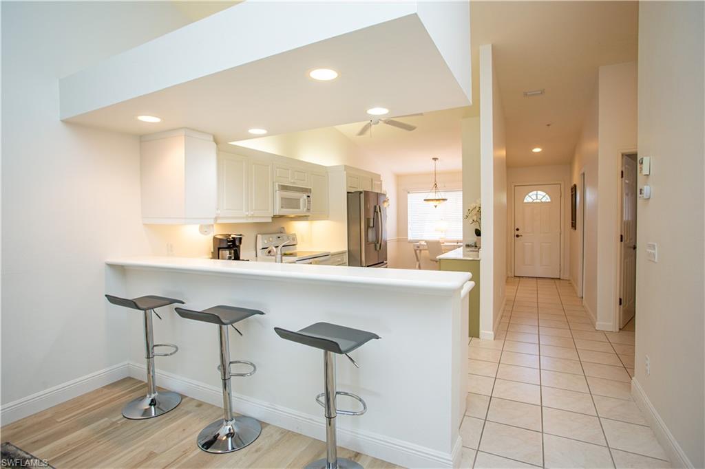 6760 Beach Resort Drive, Unit 2 Naples, FL 34114 - Photo 5 of 24 a kitchen with a sink cabinets and appliances