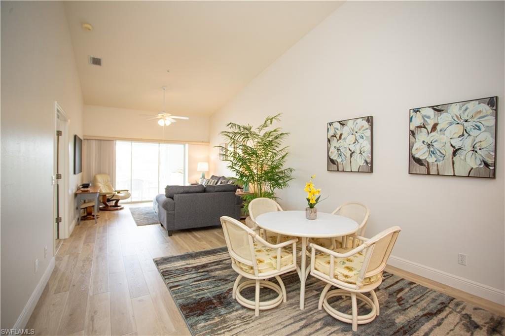 6760 Beach Resort Drive, Unit 2 Naples, FL 34114 - Photo 7 of 24 a view of a dining room with furniture and wooden floor