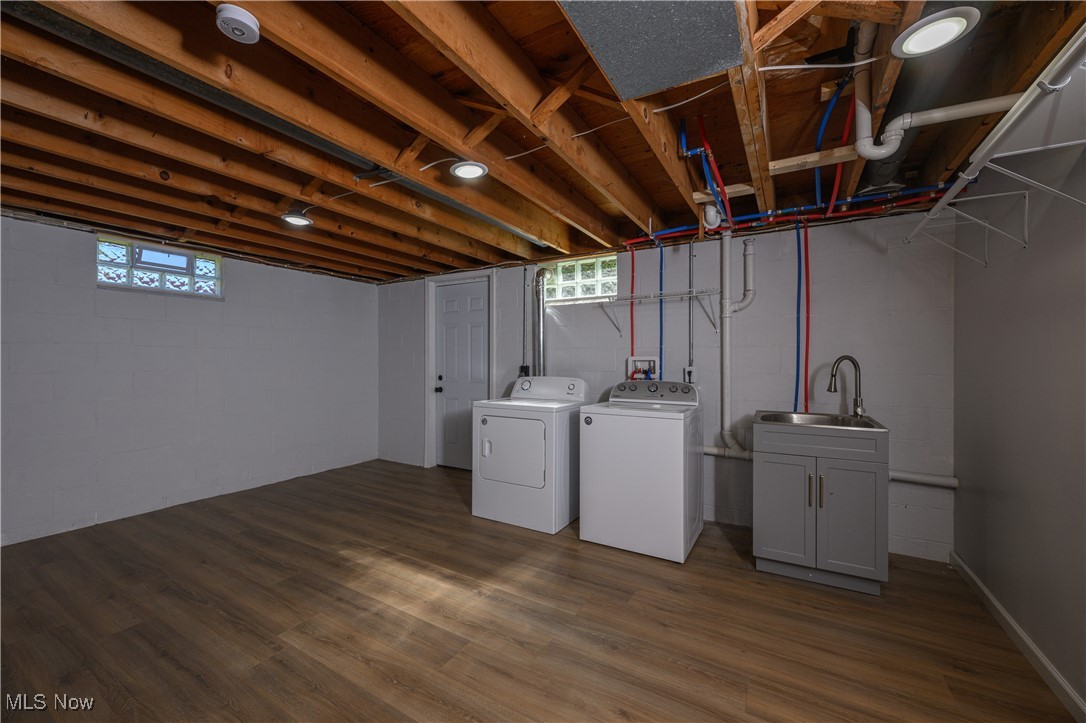 3012 Shellhart Road Barberton, OH 44203 - Photo 24 of 28 Basement with dark wood-style floors and independent washer and dryer