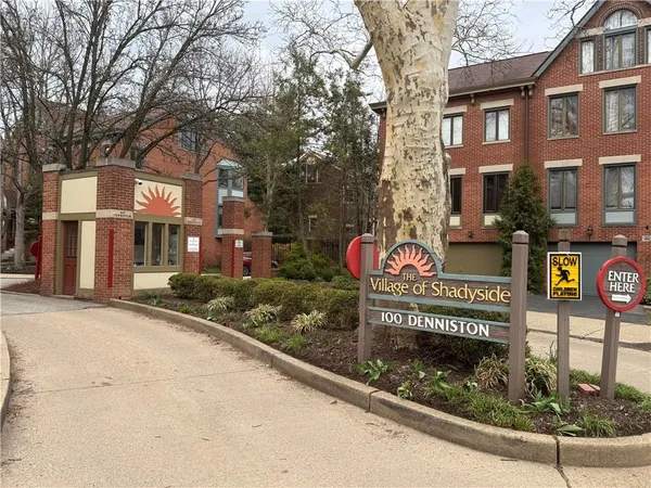 a sign on a pole on a street