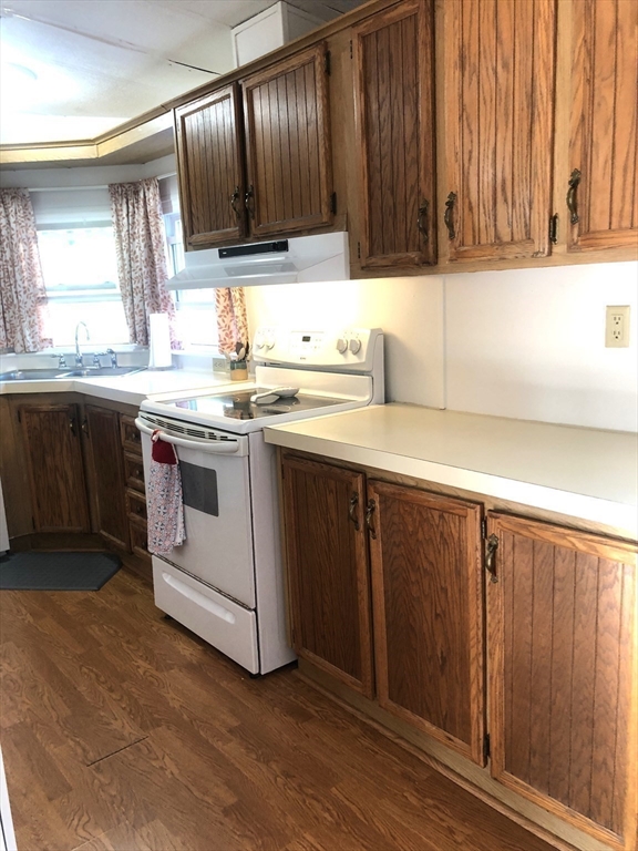 41 Pipers Way Carver, MA 02330 - Photo 14 of 36 a kitchen with a sink and a stove
