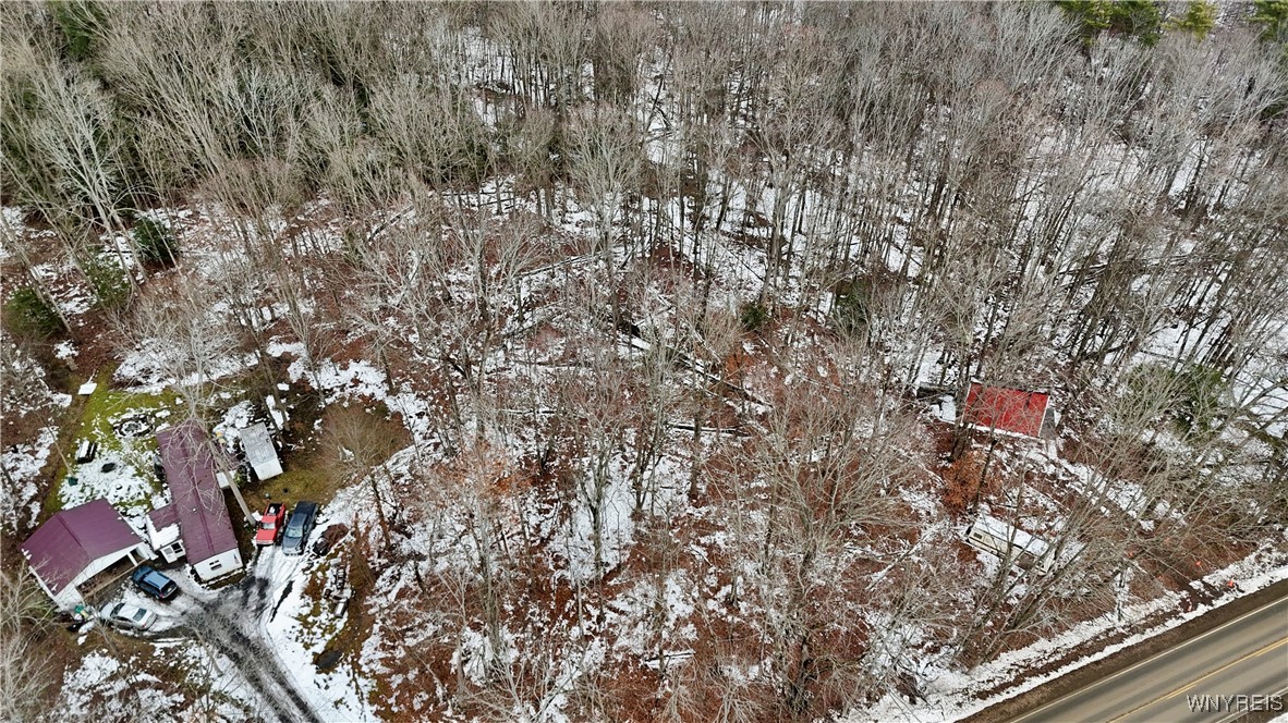 Cr-49 Caneadea, NY 14717 - Photo 6 of 8 Land is between the buildings with the purple & re