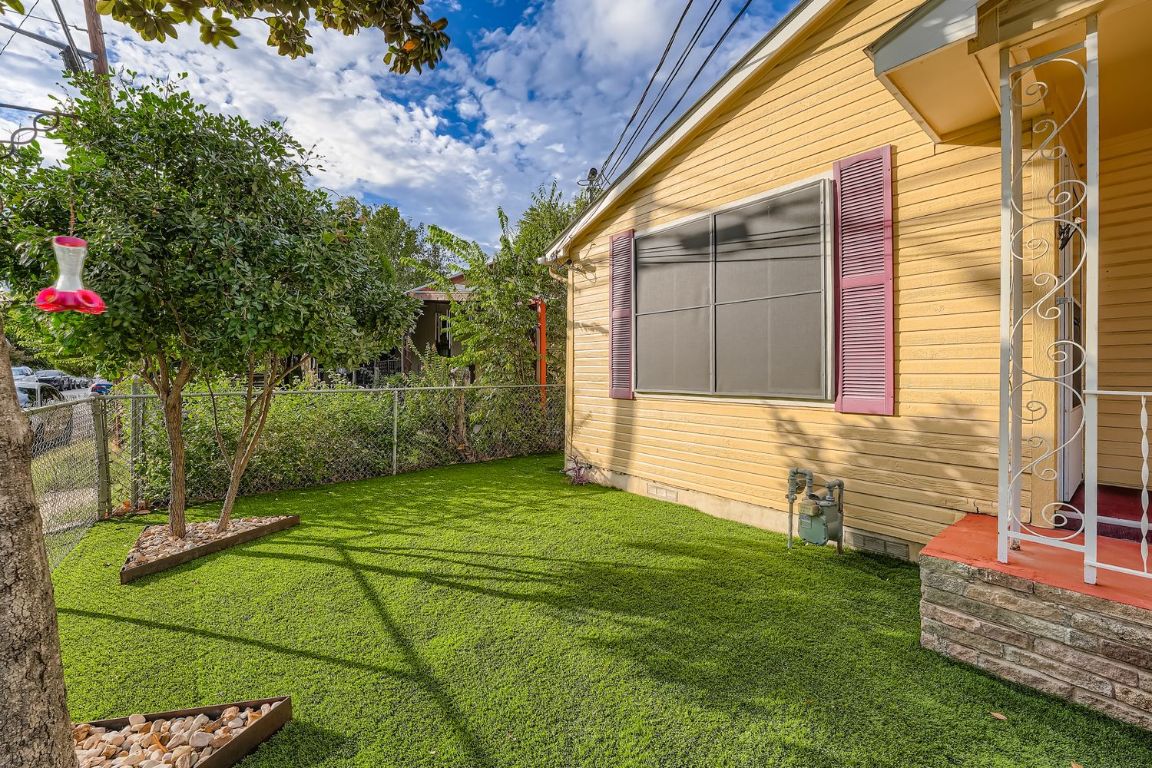 2308 Santa Rita Street Austin, TX 78702 - Photo 23 of 27 a view of a house with a backyard