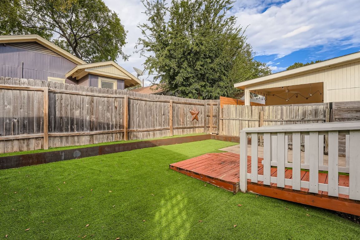 2308 Santa Rita Street Austin, TX 78702 - Photo 26 of 27 a view of backyard with deck and a garden