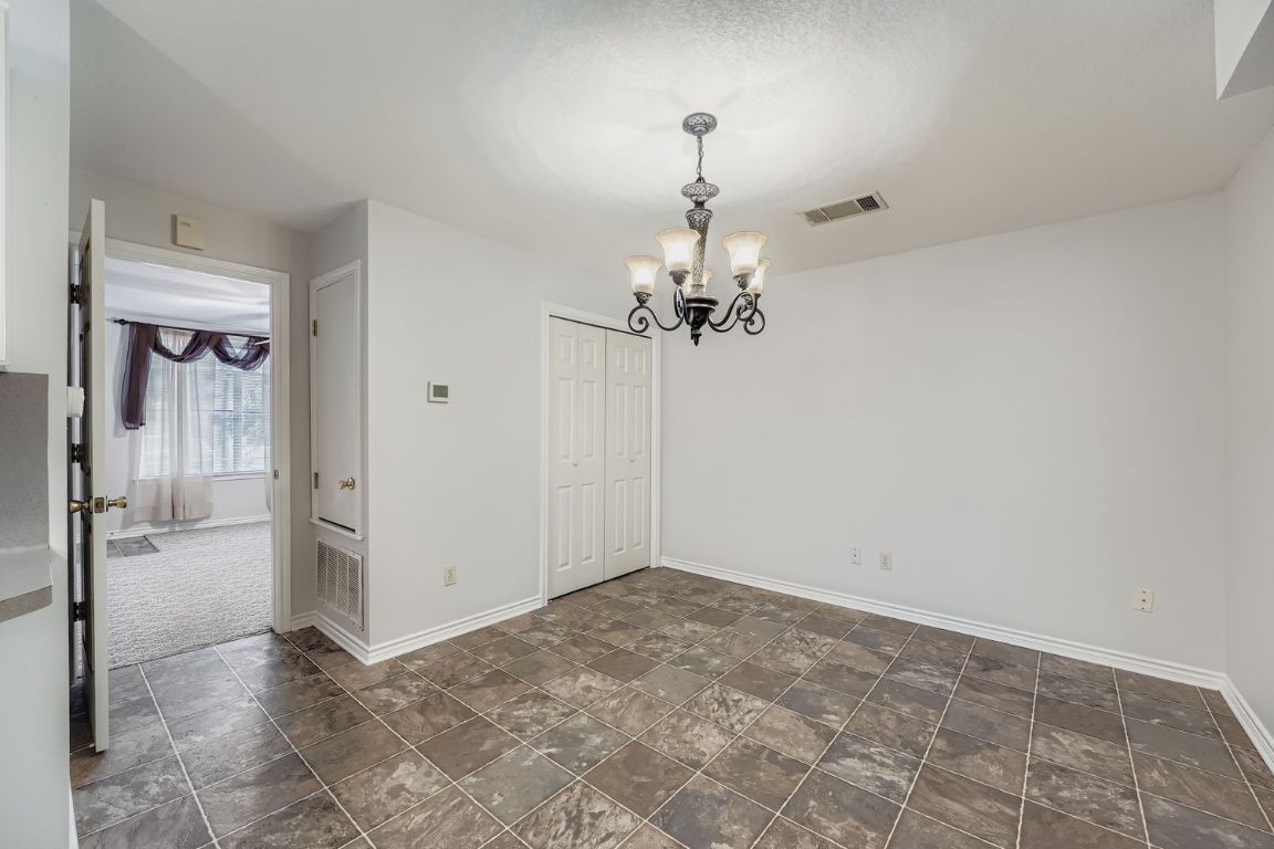 2308 Santa Rita Street Austin, TX 78702 - Photo 8 of 27 a view of a livingroom with a chandelier