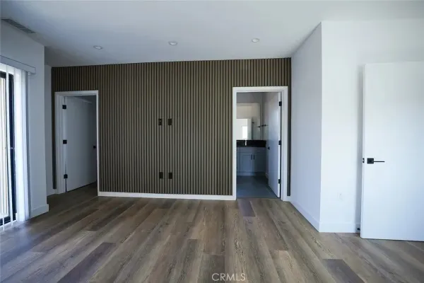 a view of hallway with wooden floor
