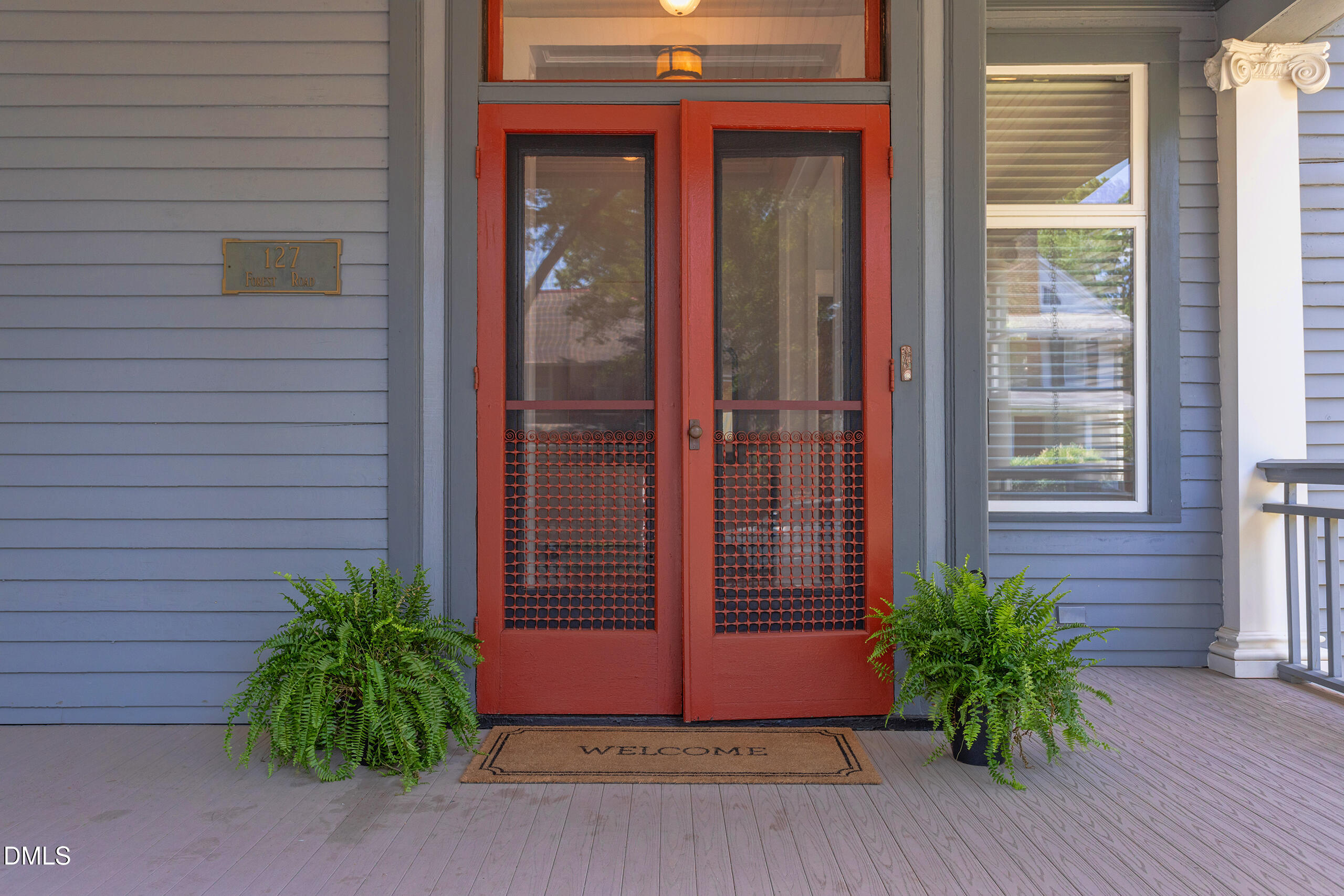 127 Forest Road Raleigh, NC 27605 - Photo 4 of 75 a potted plant in front of a glass door