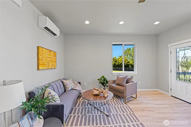 a living room with furniture and window